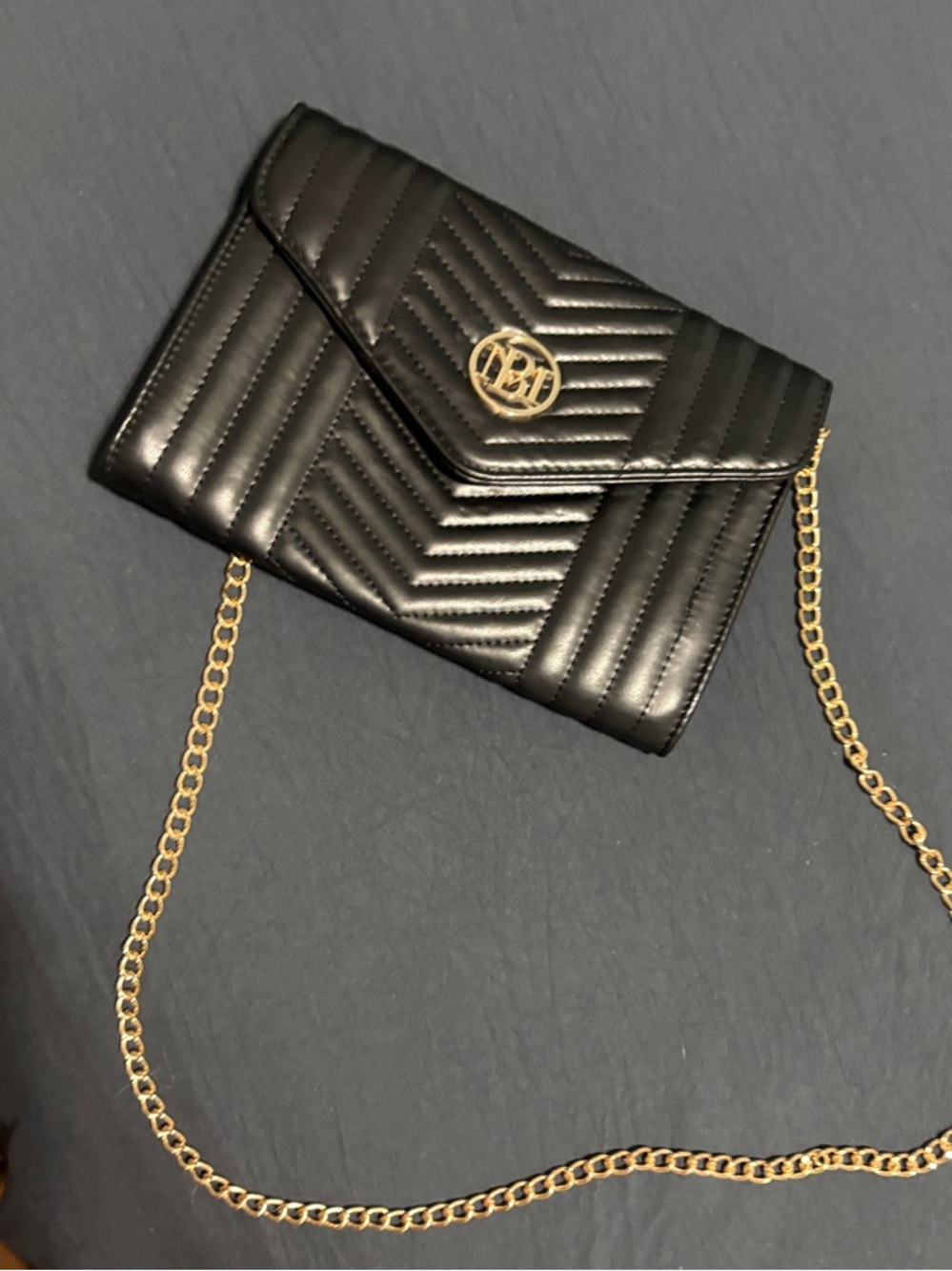 Black Quilted Crossbody with Gold Chain and Logo Accent